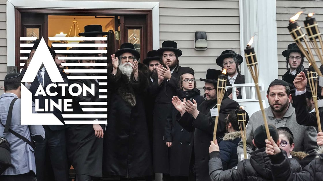 Rabbi Chaim Rottenberg celebrates with people the arrival of a new Torah at his residence in Monsey, New York, where five Jewish believers were stabbed by an attacker the previous night during a Hanukkah celebration.