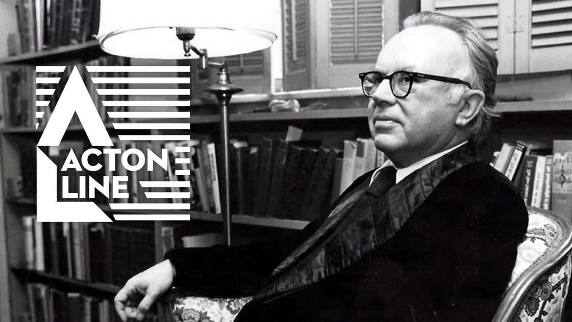 Russell Kirk sitting in his home library